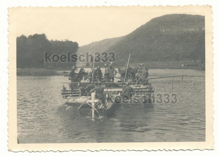 Pontoon  feery wirh a 15cm sIG33 gun being pushed by a Sturmboot 39